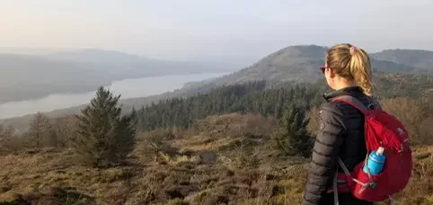 Standing with my dog overlooking a lake in the Lake District, a peaceful moment of space and reflection.