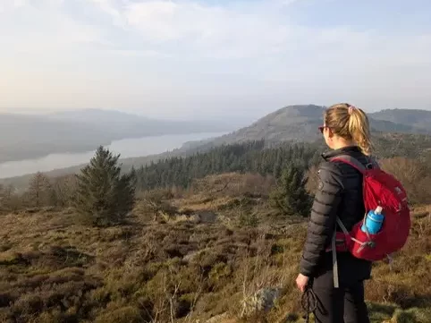 Standing with my dog overlooking a lake in the Lake District, a peaceful moment of space and reflection.